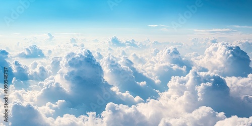 Aerial view of a sky scape featuring blue and white fluffy clouds, captured from an airplane window. This cloudscape showcases the beauty of clouds from a unique aircraft perspective. photo