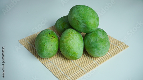 fresh green mango tropical fruit from the garden. Mangifera indica or mangga manalagi photo