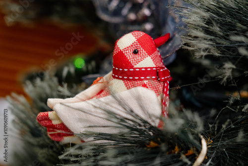 Decorated Christmas green tree decorations have bird hanging green leaves on blurred of background