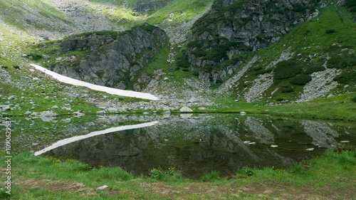 Maramures Mountains Natural Park with reflections on water pond, Romania photo