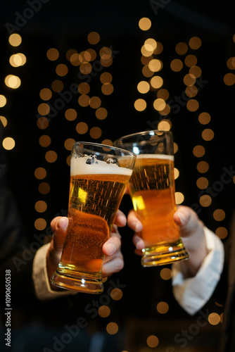 food and drink male friends are happy drinking beer and clinking glasses at a bar or pub.