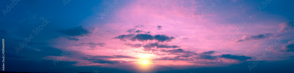Colorful cloudy sky at sunset. Sky texture. Abstract nature background. Horizontal banner