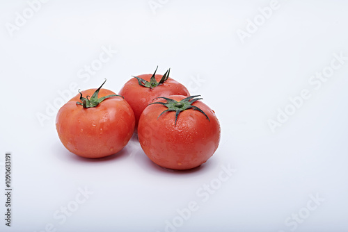Photo of fresh fruit or vegetables on a light or white background with the freshness of dew