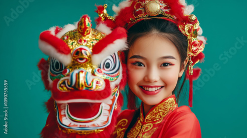 Cheerful Chiness girl in traditional Chinese costume holding a vibrant lion head symbolizing joy and prosperity during Lunar New Year photo