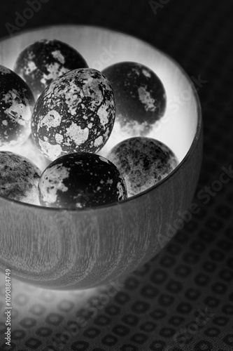 Bowl of uzura eggs close view background photo