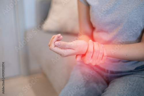 Woman female suffering from wrist sprain arthritis inflammation from physical injury problem