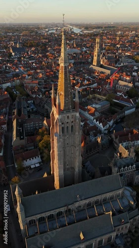 Wallpaper Mural Explore the stunning architecture of Church of Our Lady Bruges at sunset Torontodigital.ca