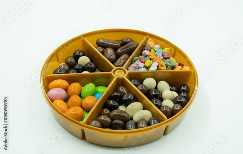 Dragee candies mixed. chocolate covered almonds, peanuts, hazelnuts and colorful candies photo