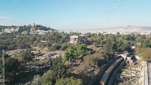 Ancient temple of Hephaestus in historical centre of Athens, Agora aerial panoramic footage