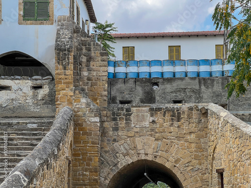 Barrel buildings and walls with sealing holes in Nicosia, Cyprus near the wall dividing the capital into two parts, Greek and Turkish.