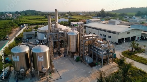 Large biofuel storage tanks, ecofriendly processing plant, modern setting