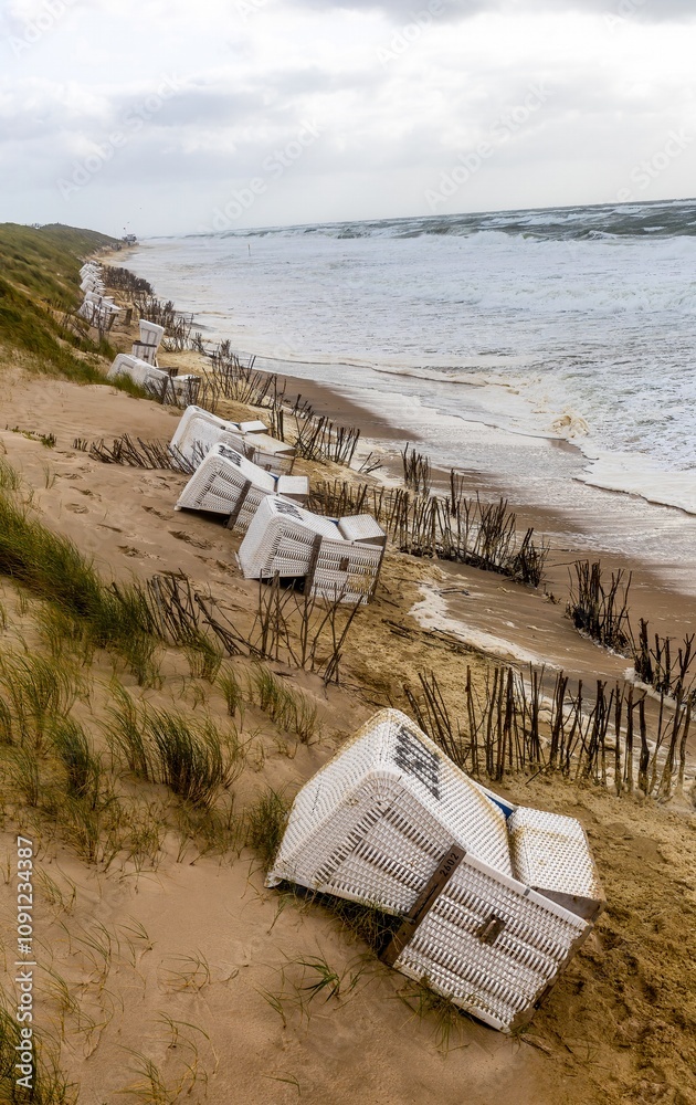 Beach chairs washed away by storm surges on the beach on the island of Sylt