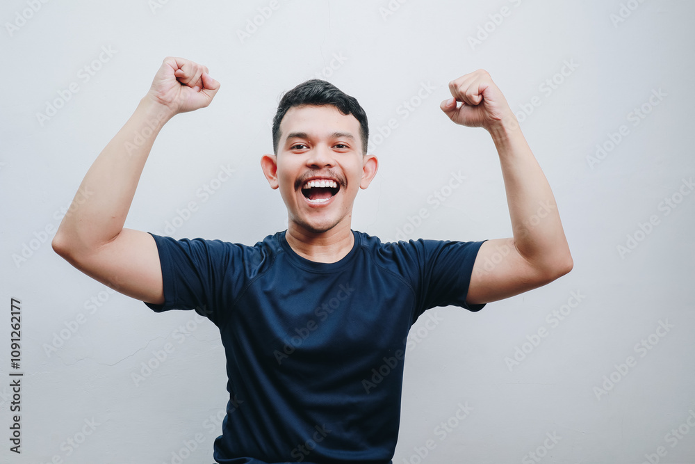 Fototapeta premium asian man happy expression raising his arms