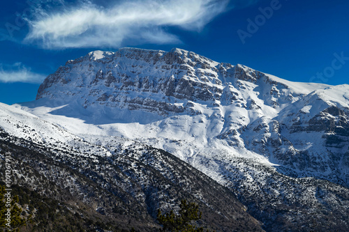 Snowy landscape of Tymfi mountain near the village of Papigo at the area of Zagori, Epirus, Greece photo