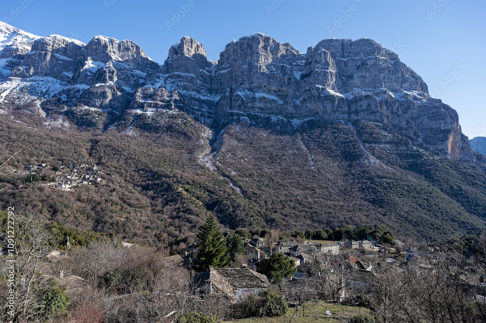 Fototapeta premium Snowy landscape of Tymfi mountain near the village of Mikro Papigo at the area of Zagori, Epirus, Greece