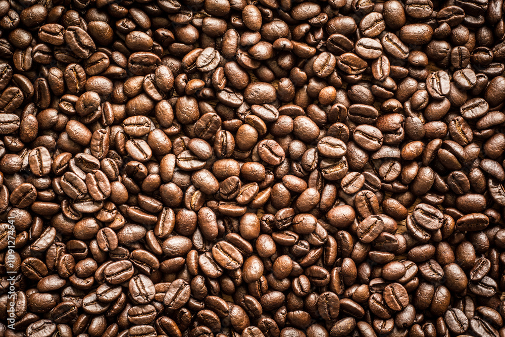 Obraz premium A roasted coffee beans texture background.