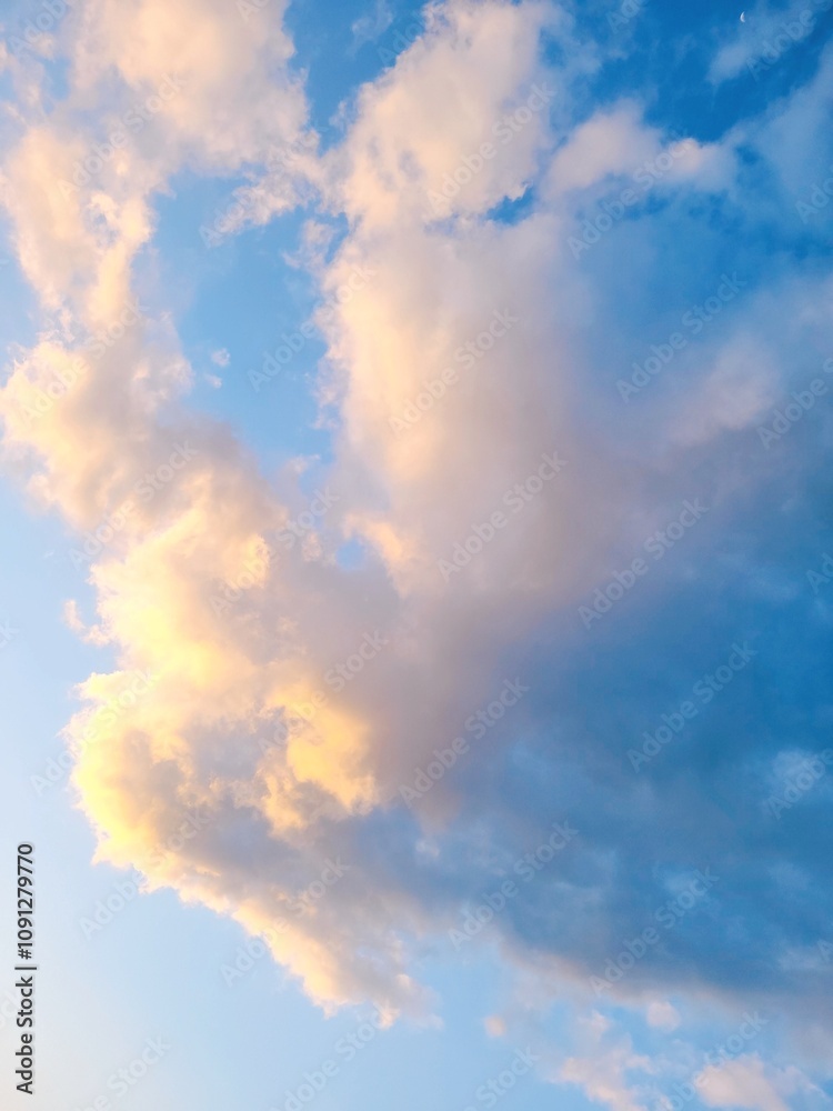 Fototapeta premium A vast expanse of clear blue sky stretches endlessly, its vibrant hue glowing with a serene brilliance. 