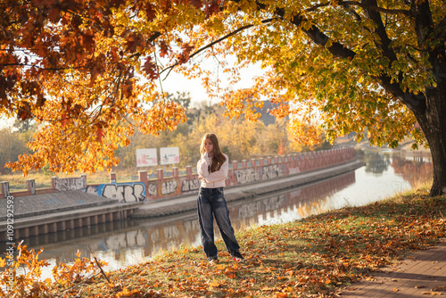 person walking in autumn park