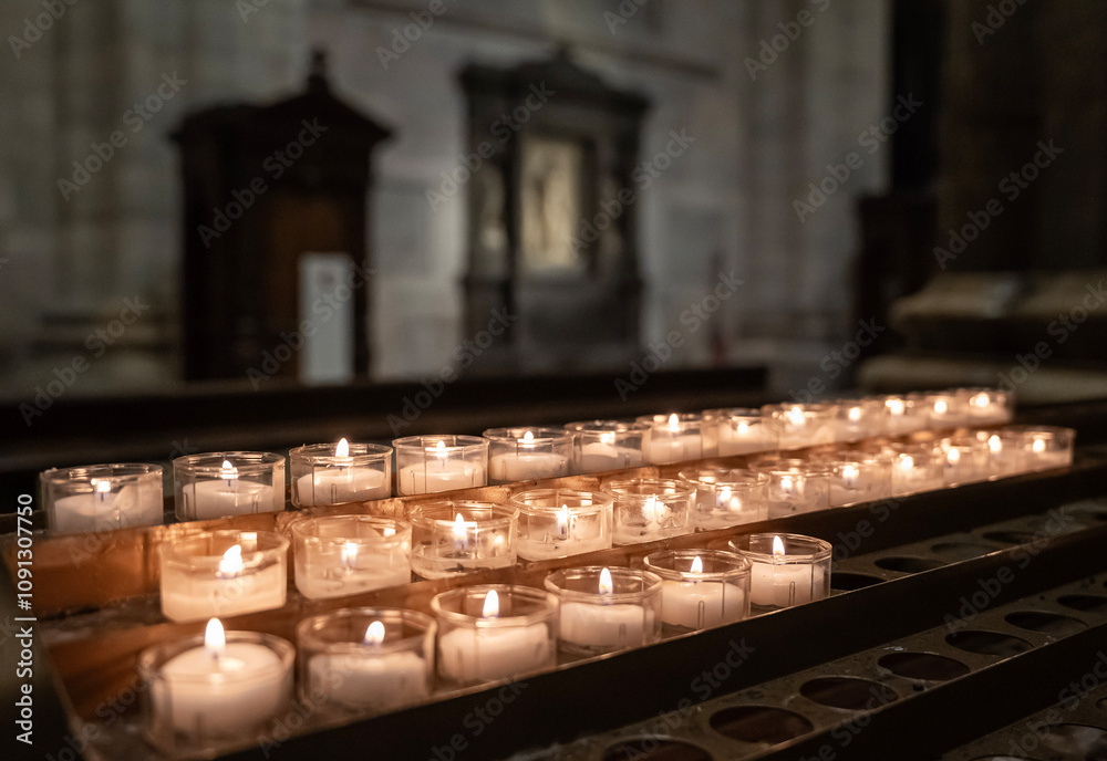 lit candles in church during prayer