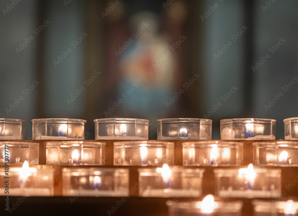 lit candles in church during prayer