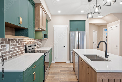 A kitchen with a green color theme and a white countertop photo