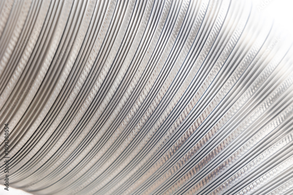 Obraz premium Flexible corrugated aluminum tube texture. Shiny silver foil banner background