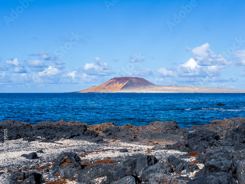 Stunning View of a Solitary Volcano on La Graciosa Island Surrounded by Azure Waters