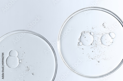 The texture of a cosmetic serum or body gel in a Petri dish.
