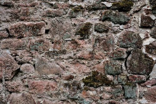 Obraz na płótnie A wall made of stone with a rough texture. The wall is brown and white w salonie