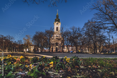 Obraz na płótnie Flowerbed in front of Serbian Orthodox Church in Kikinda w salonie