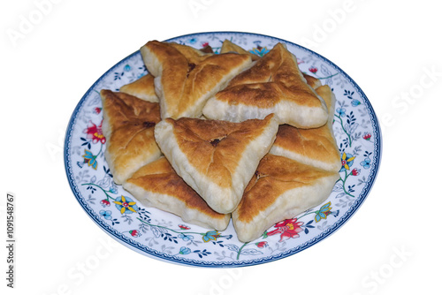 Homemade fried pies with minced meat on a plate isolate on a white background.