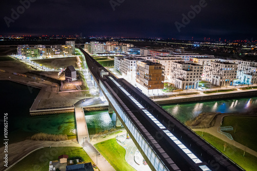 Vienna, Austria - December 27, 2022. New modern hipster quarter Asperner See Seestadt in Winter night photo