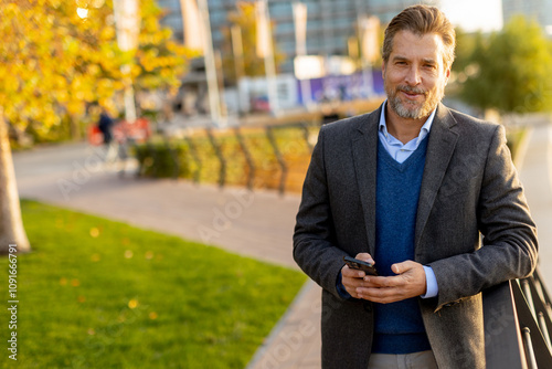 A confident businessman enj...