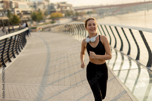 Joyful jogger enjoying a mo...