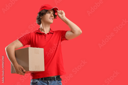 Male courier with cardboard...