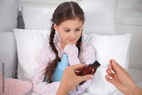 Sick little girl with hot w...