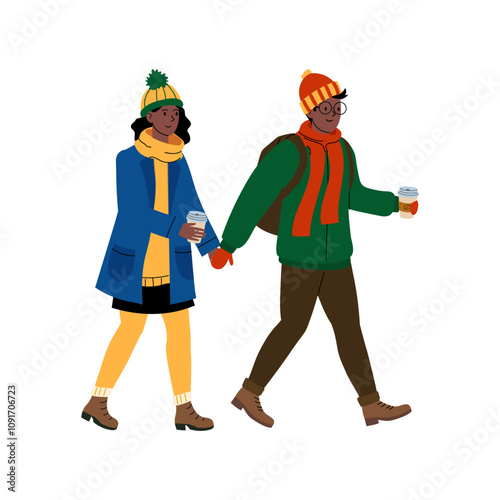Young couple enjoying a winter stroll while holding hands and sipping warm beverages