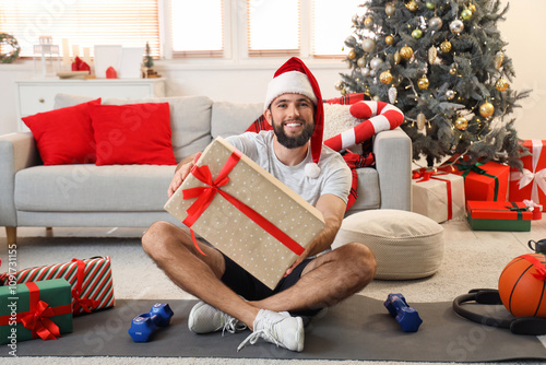 Young happy man in Santa ha...