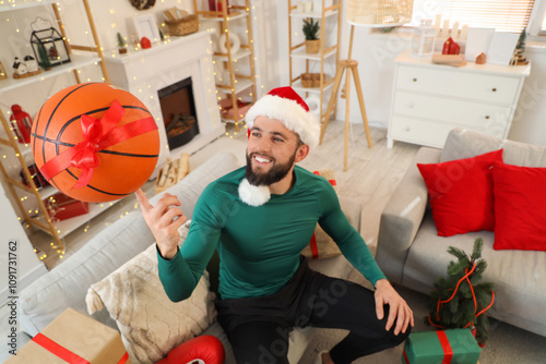 Young happy man in Santa ha...