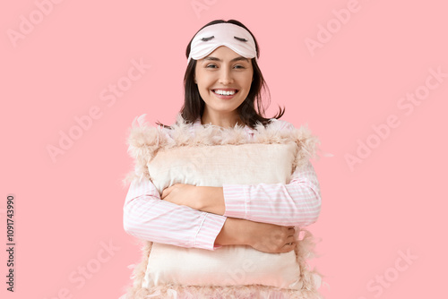 Smiling young woman in pink...