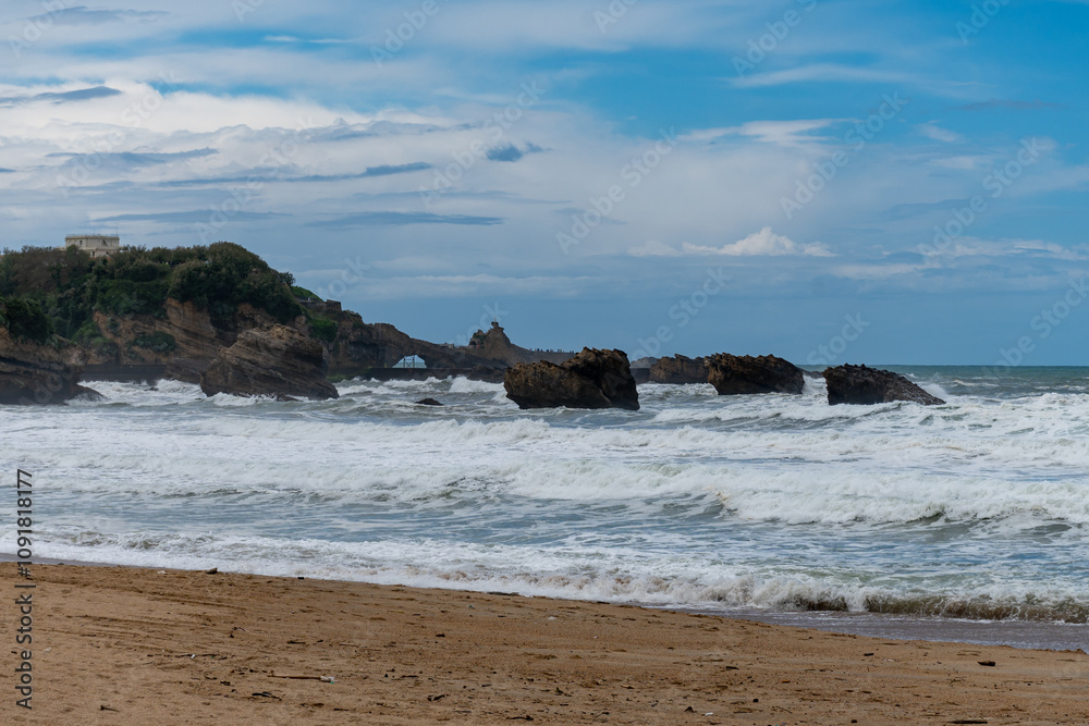 Fototapeta premium Panoramic view from Grand Plage on cliffs, houses, sandy beaches of touristic Biarritz city, Basque Country, Bay of Biscay of Atlantic ocean, France