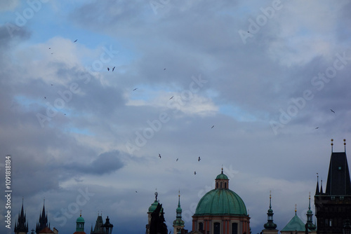 Canvas Print skyline and domes in prague with birds