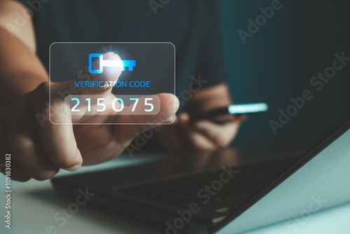 OTP, Two factor authentication or 2FA concept. Man hand press verification code with key icon while using smartphone and laptop computer for validate password, secure steps, cyber security technology. photo