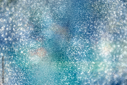 festive glittering Christmas lights. Blurred blue abstract background for hol...