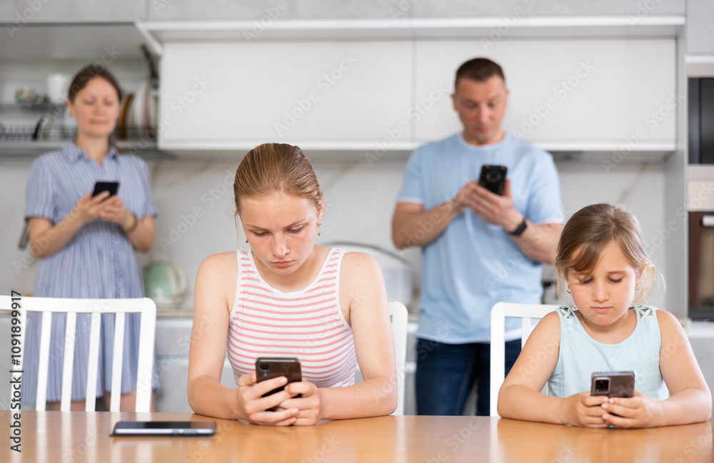 Portrait of happy children and parents using phones at home Portrait of happy children and parents using phones at home