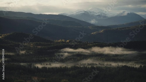 Panoramic mountainous woodland region of Norway with morning fog photo