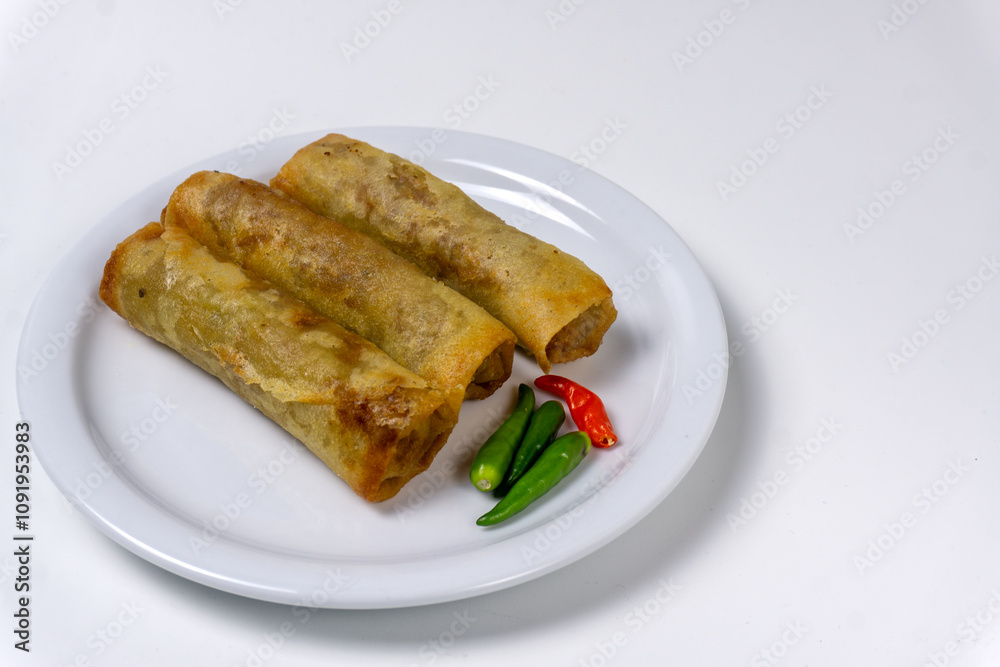 Lumpia or lunpia, traditional snacks from Semarang, Central Java, Indonesia. Traditional spring rolls contain stir-fried bamboo shoots Lumpia or lunpia, traditional snacks from Semarang, Central Java, Indonesia. Traditional spring rolls contain stir-fried bamboo shoots
