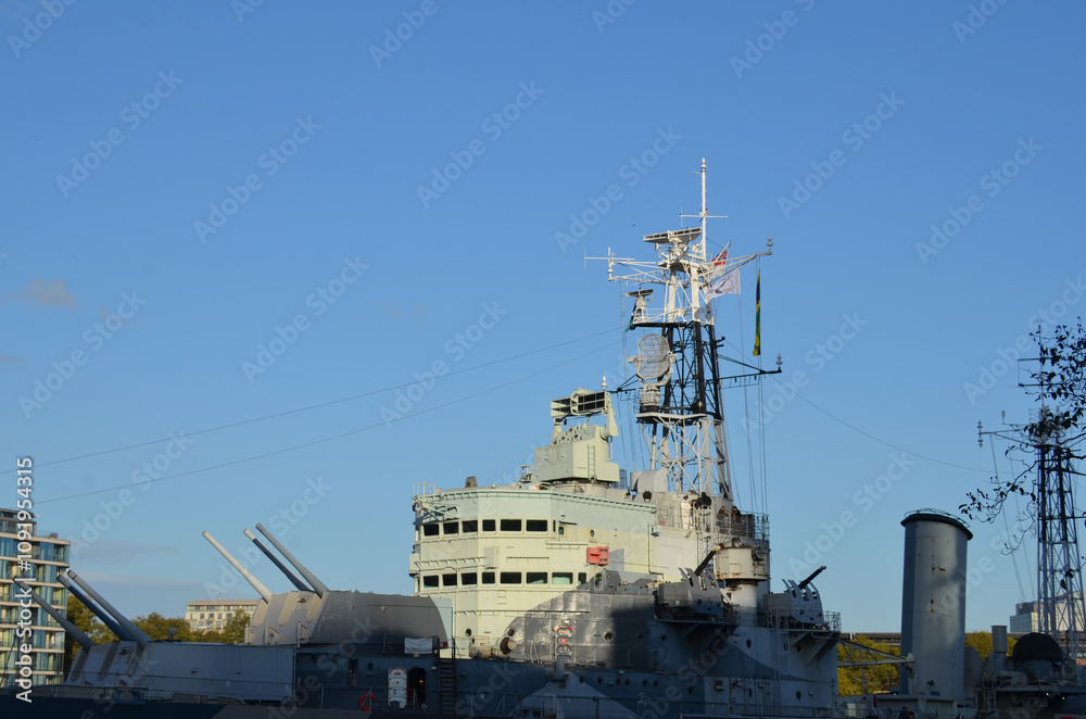 London, UK - February 19, 2024: HMS Belfast, a light cruiser built for Royal Navy, now permanently moored in the River Thames as a museum ship, London, England. London, UK - February 19, 2024: HMS Belfast, a light cruiser built for Royal Navy, now permanently moored in the River Thames as a museum ship, London, England.