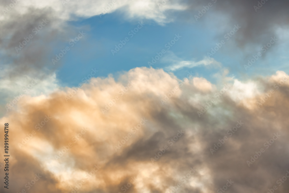 A beautiful sky tinted by the sun leaving vibrant shades of gold, pink, blue and multicolored. Clouds in the twilight evening and morning sky. Cloudy sky background in the evening, and during the day. A beautiful sky tinted by the sun leaving vibrant shades of gold, pink, blue and multicolored. Clouds in the twilight evening and morning sky. Cloudy sky background in the evening, and during the day.