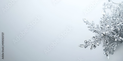 A shining snowflake, located on the right side, isolated on a panoramic silver background with ample copy space --ar 2:1 --s 50.